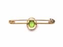 An Old 9ct Synthetic Peridot Brooch